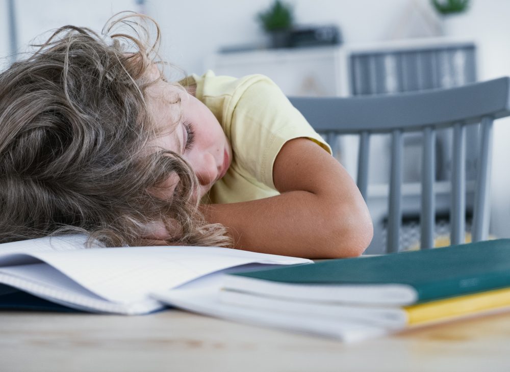 close-up-of-a-tired-kid-sleeping-with-his-head-VE6TYD7 close-up-of-a-tired-kid-sleeping-with-his-head-VE6TYD7