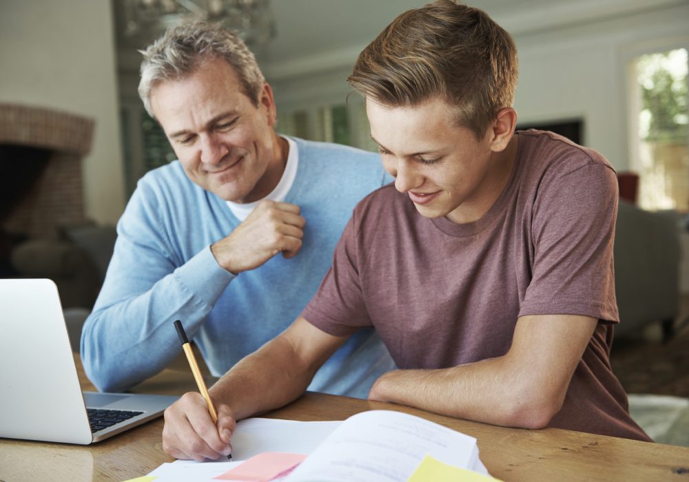 That A+ is definitely going to be yours! A father helping his teenage son with his homework