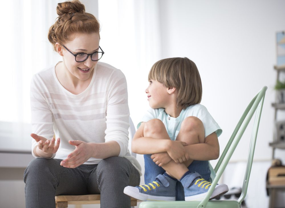 mother-talking-to-smiling-son-PTYXSQ6 mother-talking-to-smiling-son-PTYXSQ6